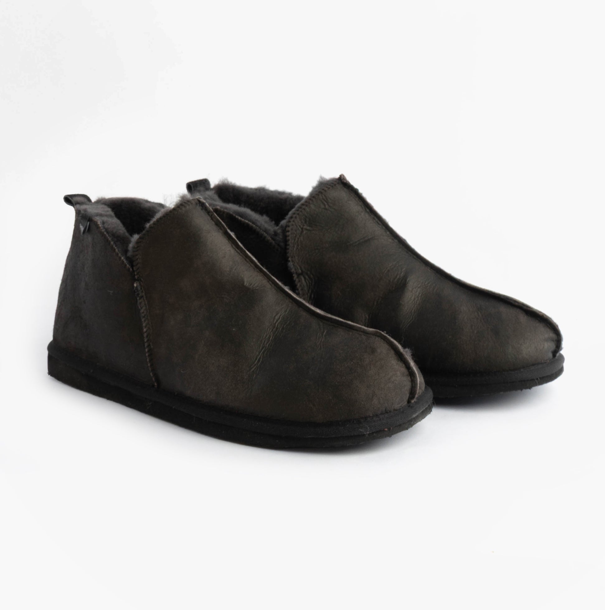 Shepherd ANTON Mens Slippers Matt Black side view showing cozy leather and suede material with casual slip-on style.