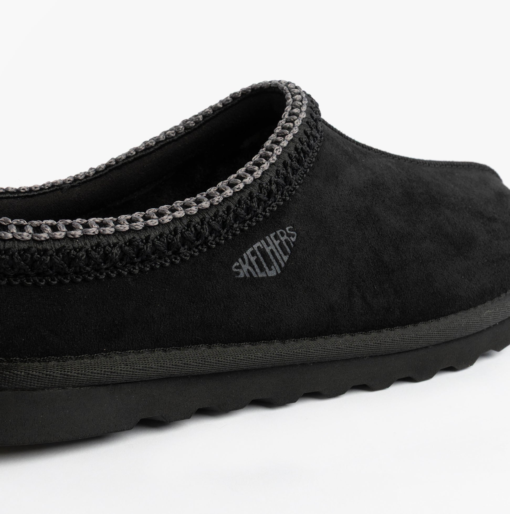 Skechers 205605/BLK RENTEN - ULRICH Mens Slippers Black side view showing upper texture and logo.
