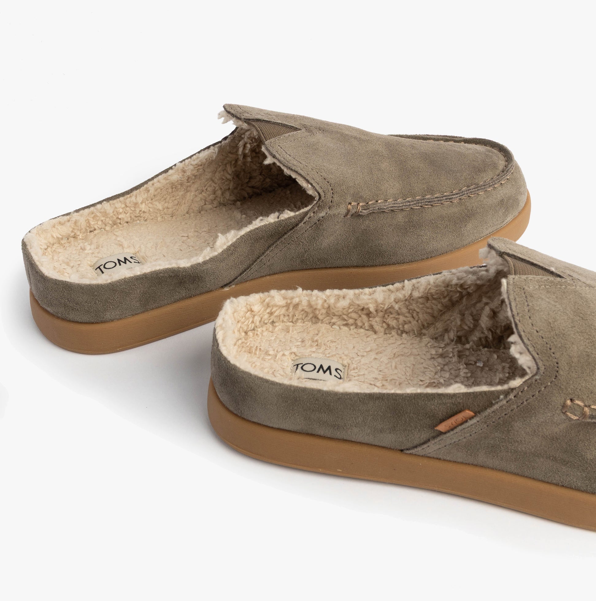 TOMS ALONSO MULE Mens Faux Shearling Lined Slippers Olive side view showcasing suede leather upper and warm shearling lining.