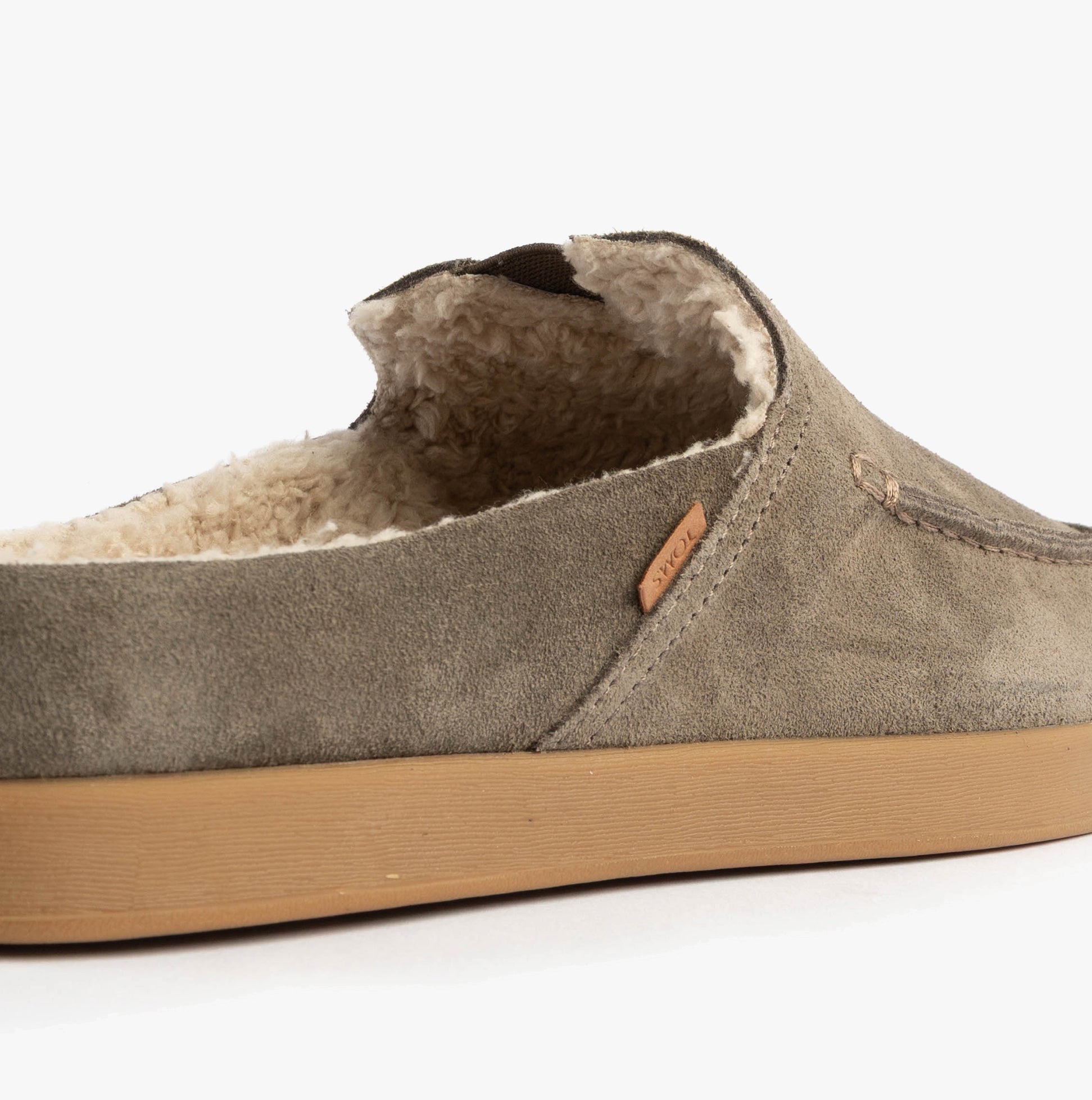 TOMS ALONSO MULE Mens Faux Shearling Lined Slippers Olive side view showcasing suede upper and warm shearling lining.