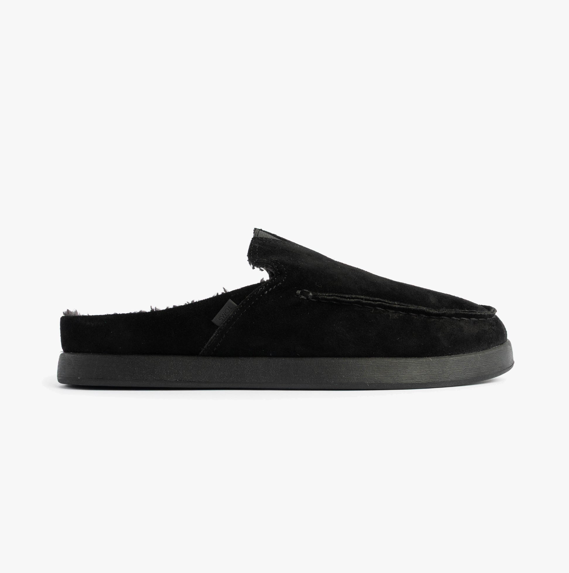 TOMS ALONSO MULE Mens Faux Shearling Lined Slippers Black side view showing suede upper and slip-on design.