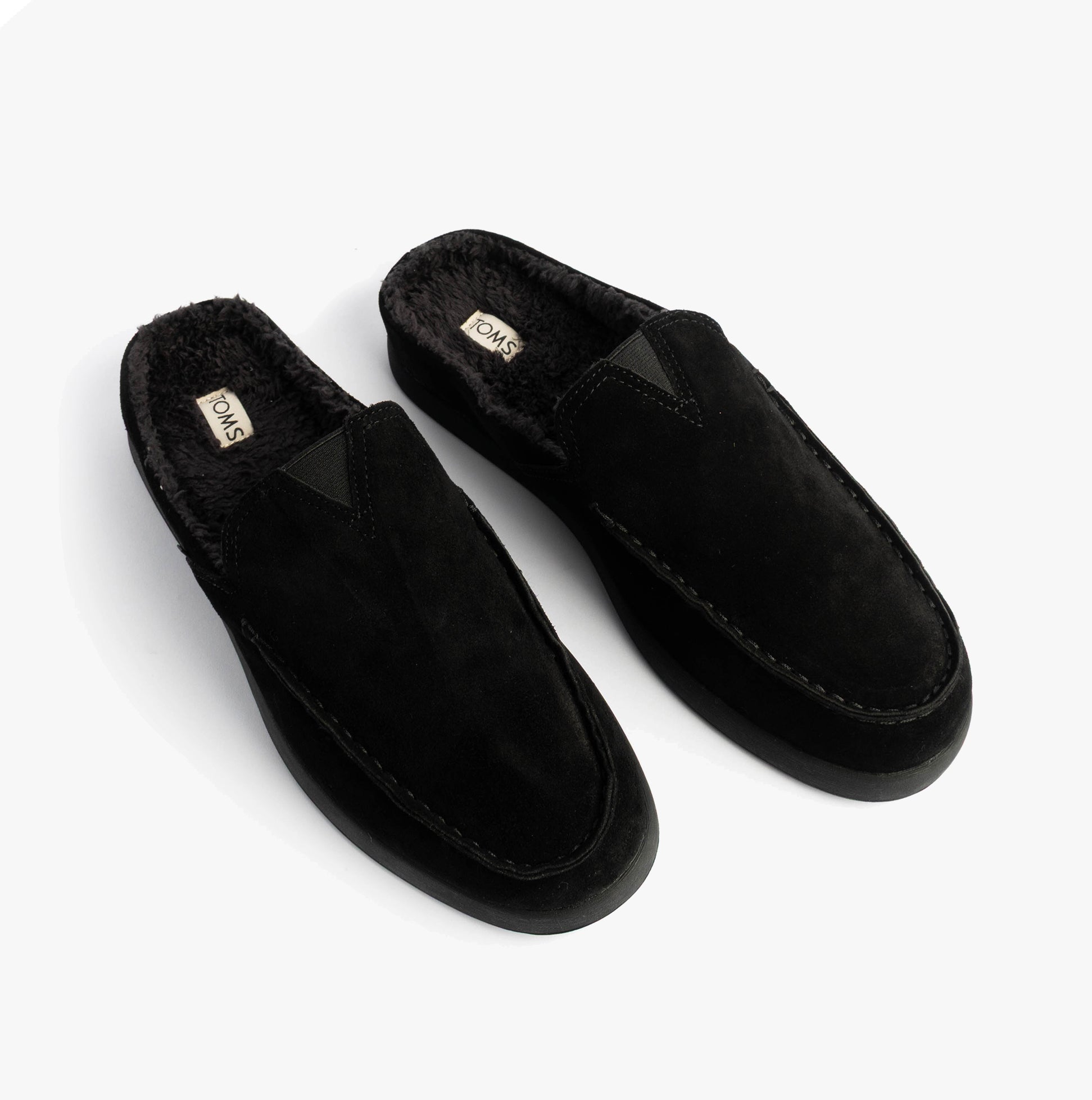 TOMS ALONSO MULE Mens Faux Shearling Lined Slippers Black top view showing suede leather upper and shearling lining.