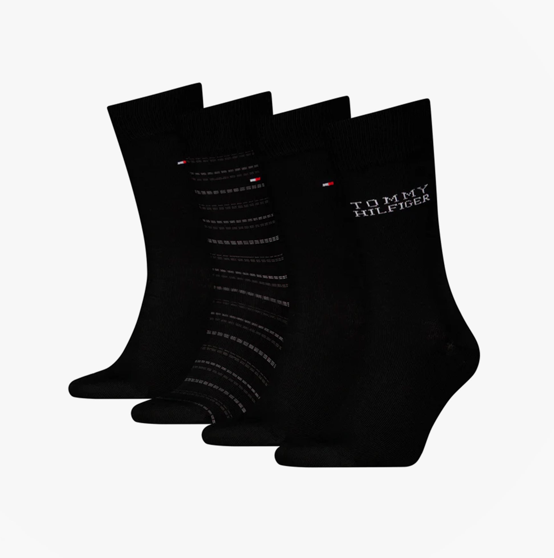 Tommy Hilfiger 4 Pack Giftboxed Classic Mens Crew Socks Black, displayed front view showing four pairs, two solid and two patterned.