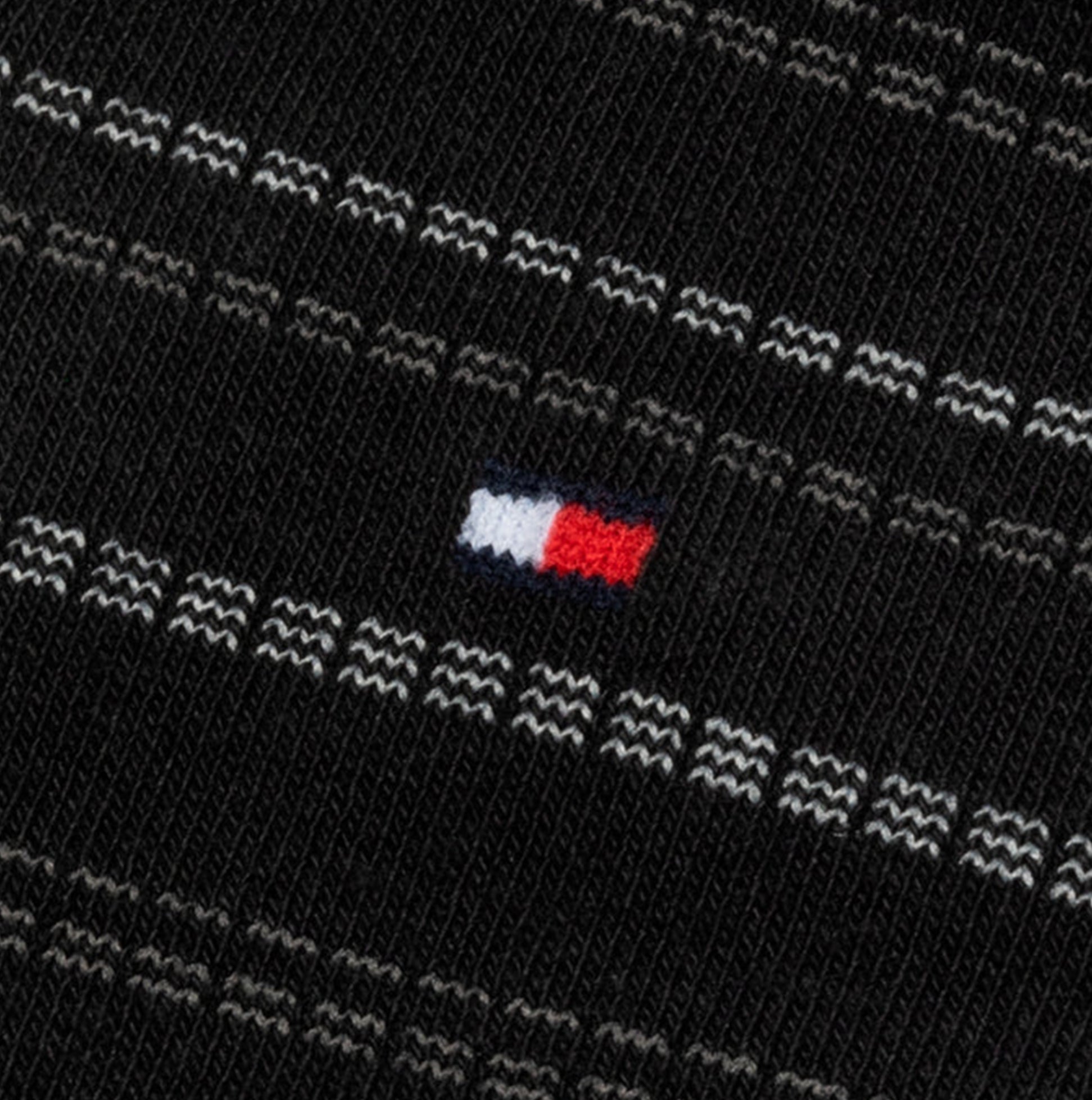 Tommy Hilfiger 4 Pack Giftboxed Classic Mens Crew Socks Black detail view showing brand logo on fabric.