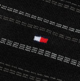 Tommy Hilfiger 4 Pack Giftboxed Classic Mens Crew Socks Black detail view showing brand logo on fabric.