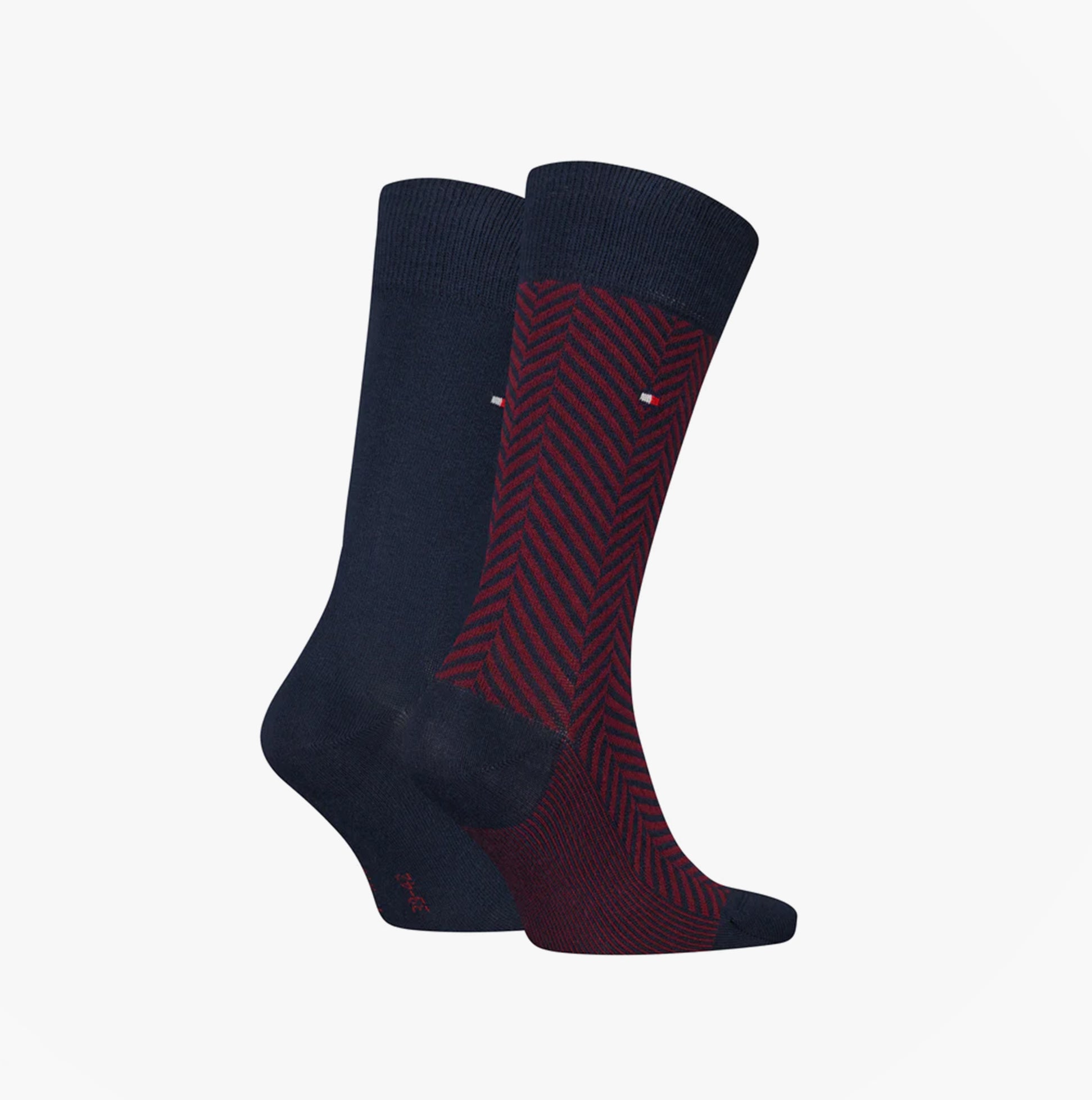 Tommy Hilfiger 2 Pack Classic Mens Crew Socks Navy showcasing one navy and one red patterned sock, side view.