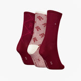 Tommy Hilfiger 3 Pack Giftboxed Monogram Womens Crew Socks Red in a side view showcasing three pairs with varying patterns.