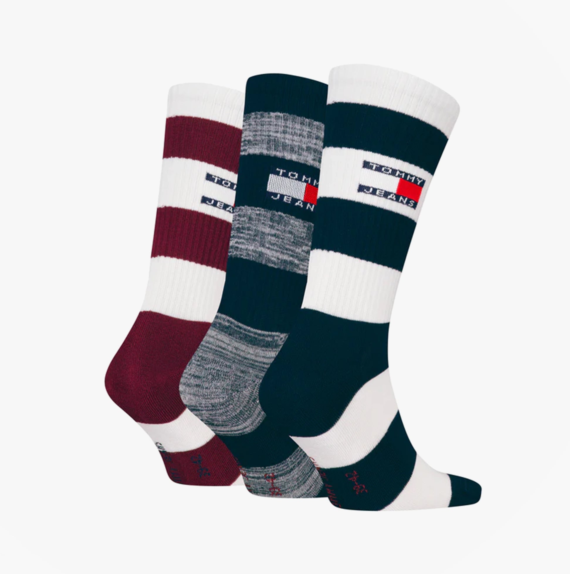 Tommy Hilfiger 3 Pack Trainer Stripe Mens Crew Socks Multi front view showcasing red, grey, and black striped designs.