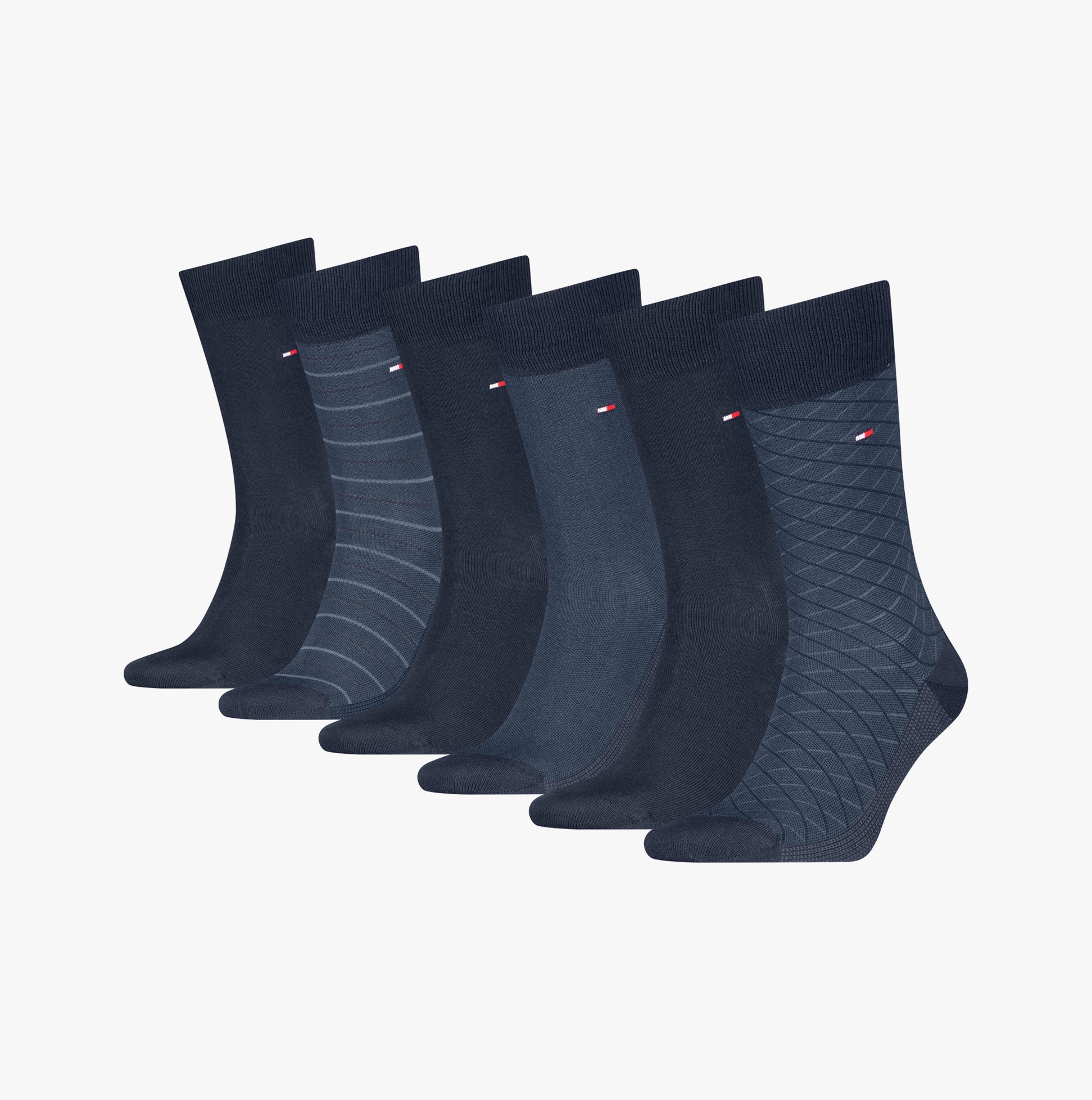 Tommy Hilfiger 6 Pack Giftbox Birdey Mens Socks Navy displayed in a row, showcasing various navy patterns and styles.