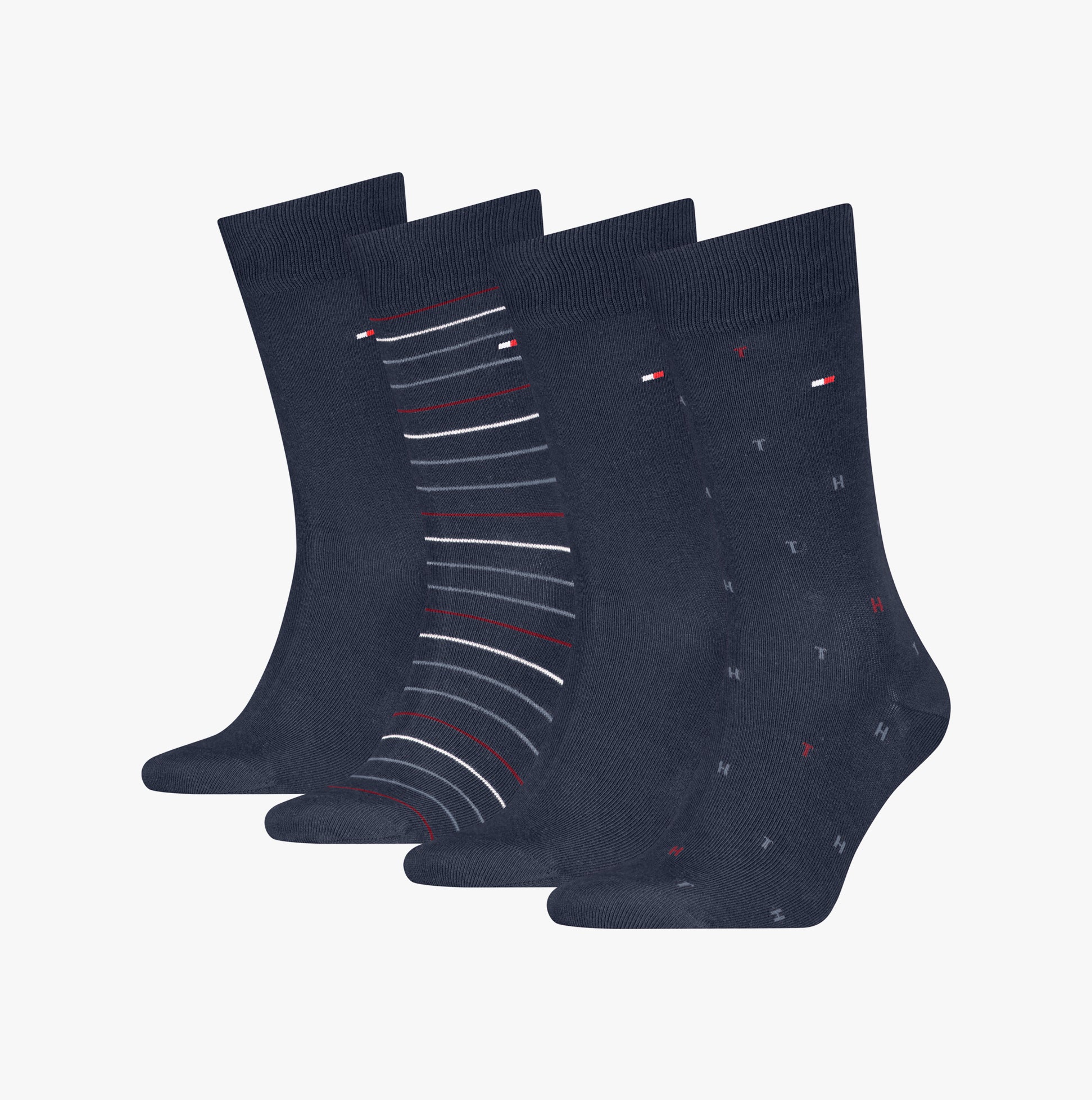 Tommy Hilfiger 4 Pack Giftbox Mens Socks Navy displayed in a front view, showcasing various patterns and colors.