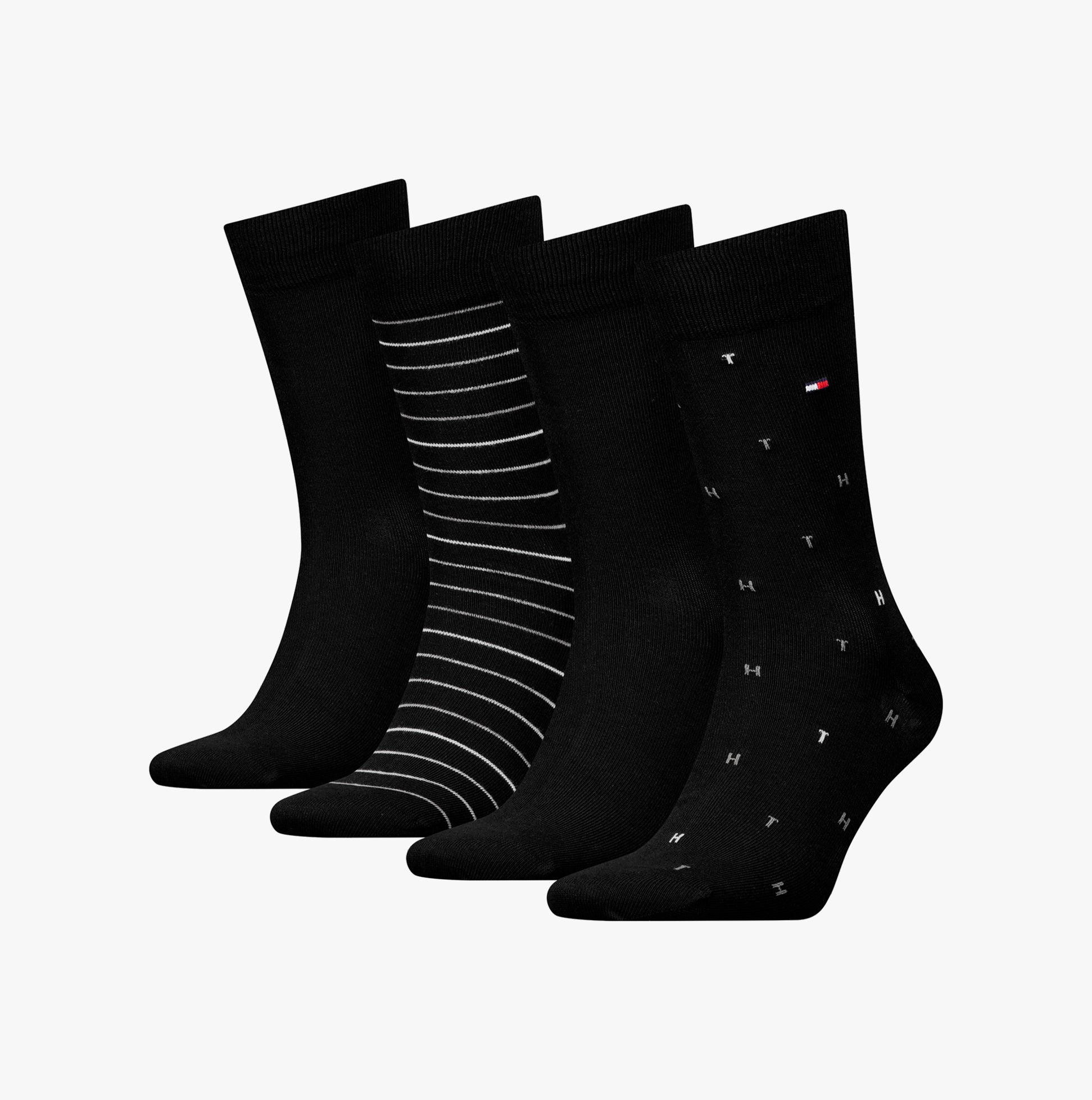 Tommy Hilfiger 4 Pack Giftbox Mens Socks Black side view, featuring black socks with various patterns in giftbox.