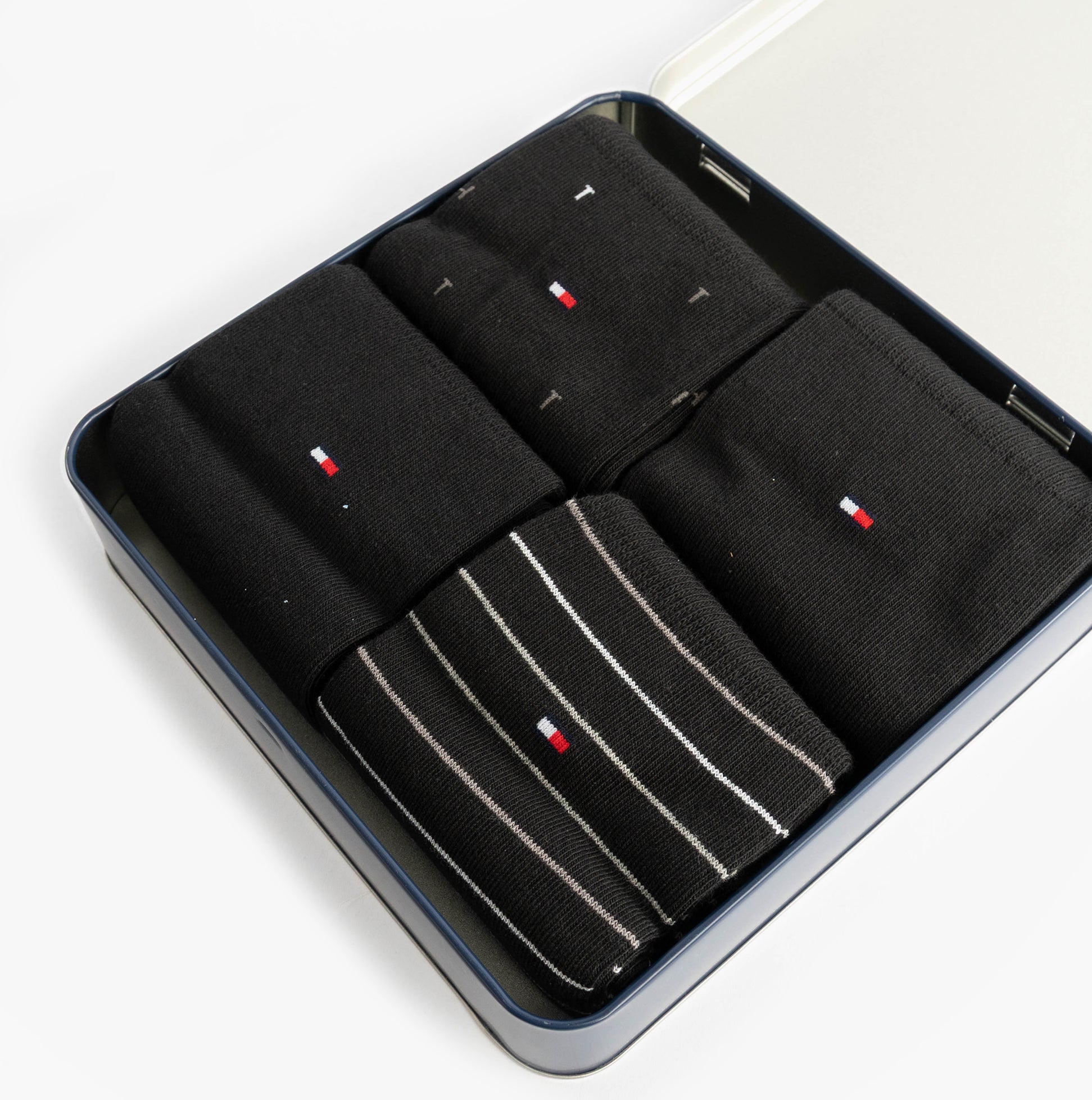 Tommy Hilfiger 4 Pack Giftbox Mens Socks Black in gift box top view showing black and striped designs.