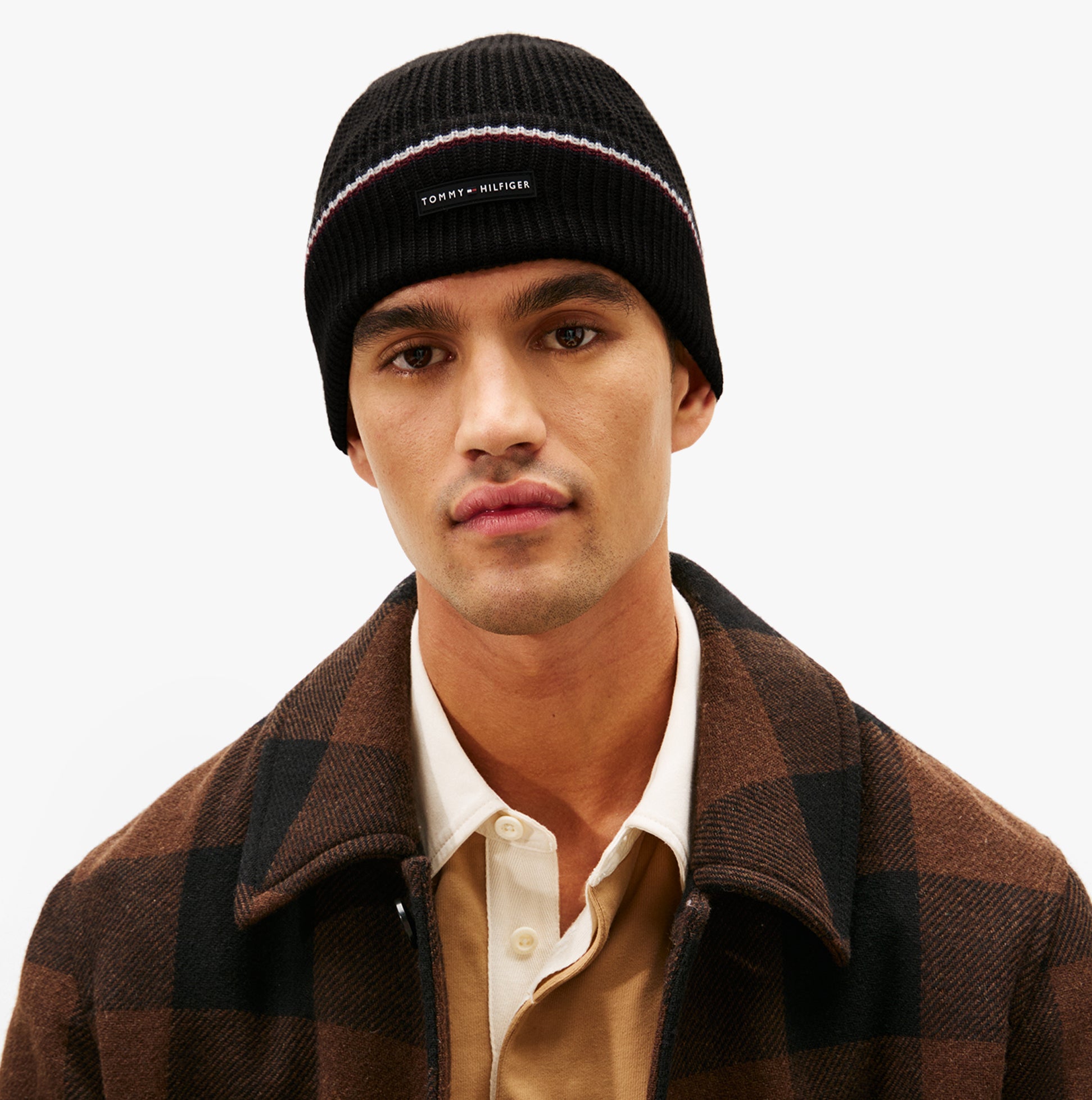 Tommy Hilfiger Signature Tape Mens Wool Beanie Black front view, model wearing beanie with brown checked coat.