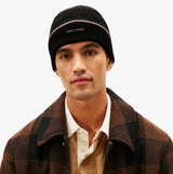 Tommy Hilfiger Signature Tape Mens Wool Beanie Black front view, model wearing beanie with brown checked coat.