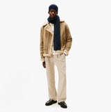 Tommy Hilfiger AM0AM13807 TH FLAG BEANIE & SCA Mens Beanie Space Bluee front view worn with scarf and jacket.