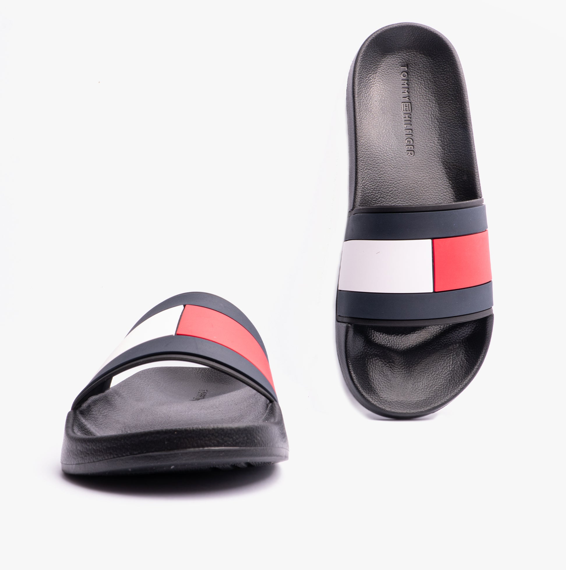 Tommy Hilfiger FLAG Mens Poolside Logo Sliders Desert Black top view showcasing vibrant logo design and slip-on style.