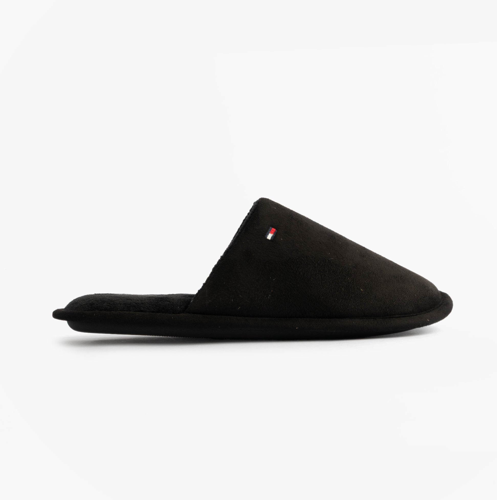 Tommy Hilfiger CORE HILFIGER FLAG H Mens Mule Slippers Black side view, showcasing the comfortable slip-on design.