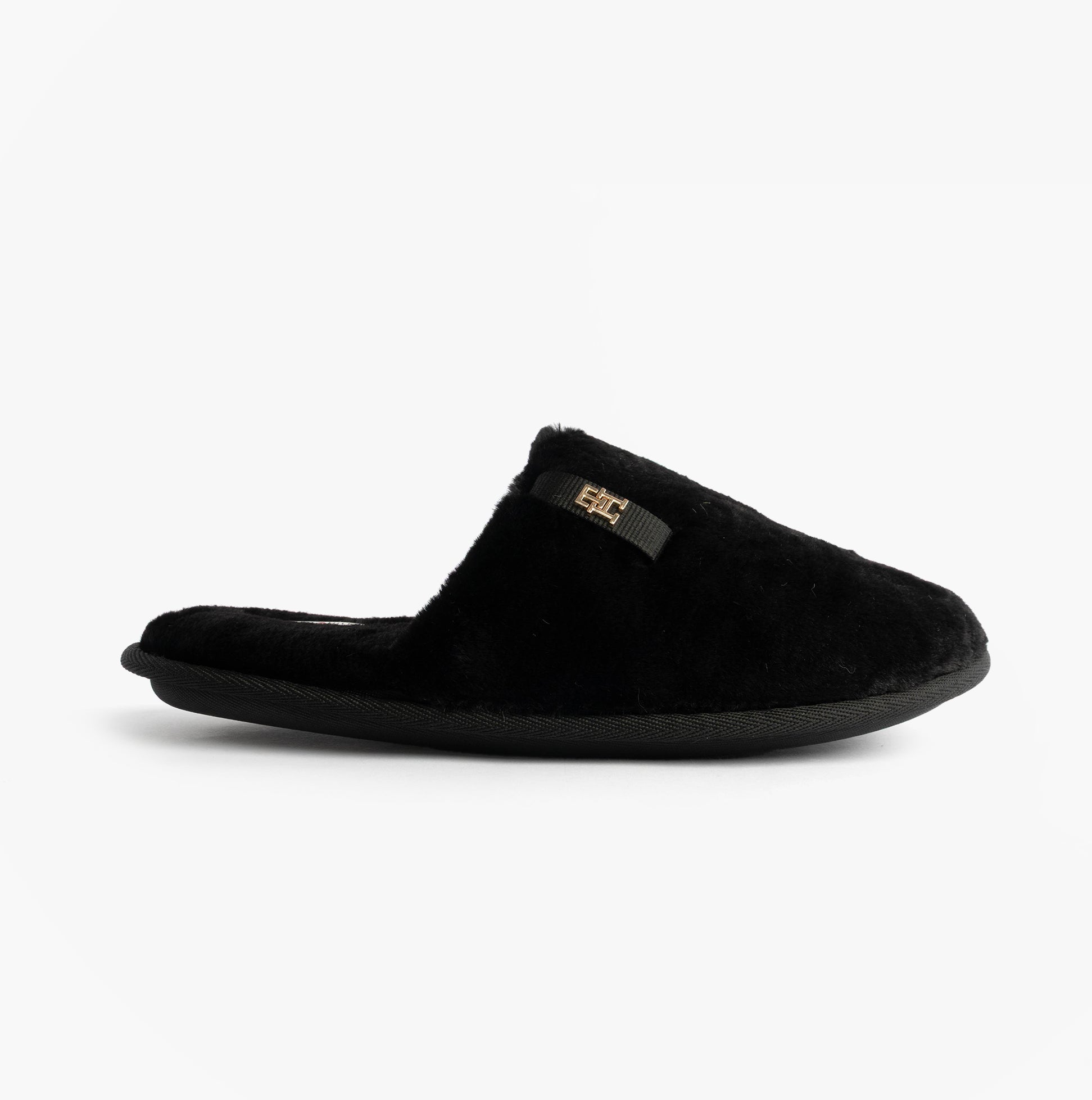 Tommy Hilfiger TH FAUX FUR HOUSE SH Womens Slippers Black side view with black faux fur upper and slip-on design.