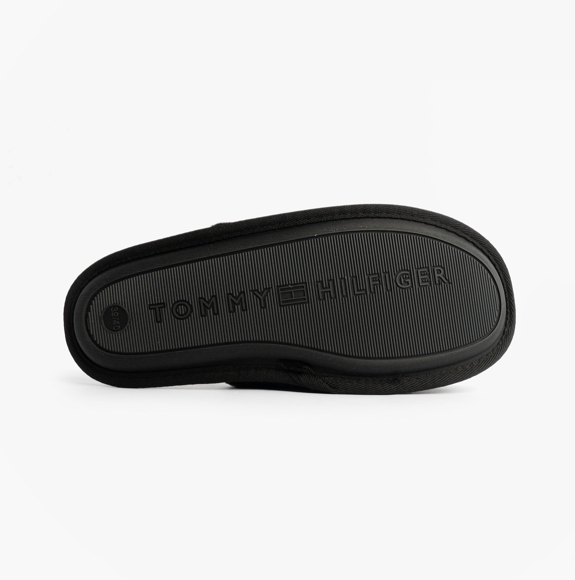 Tommy Hilfiger TH FAUX FUR HOUSE SH Womens Slippers Black bottom view showcasing textured sole design.