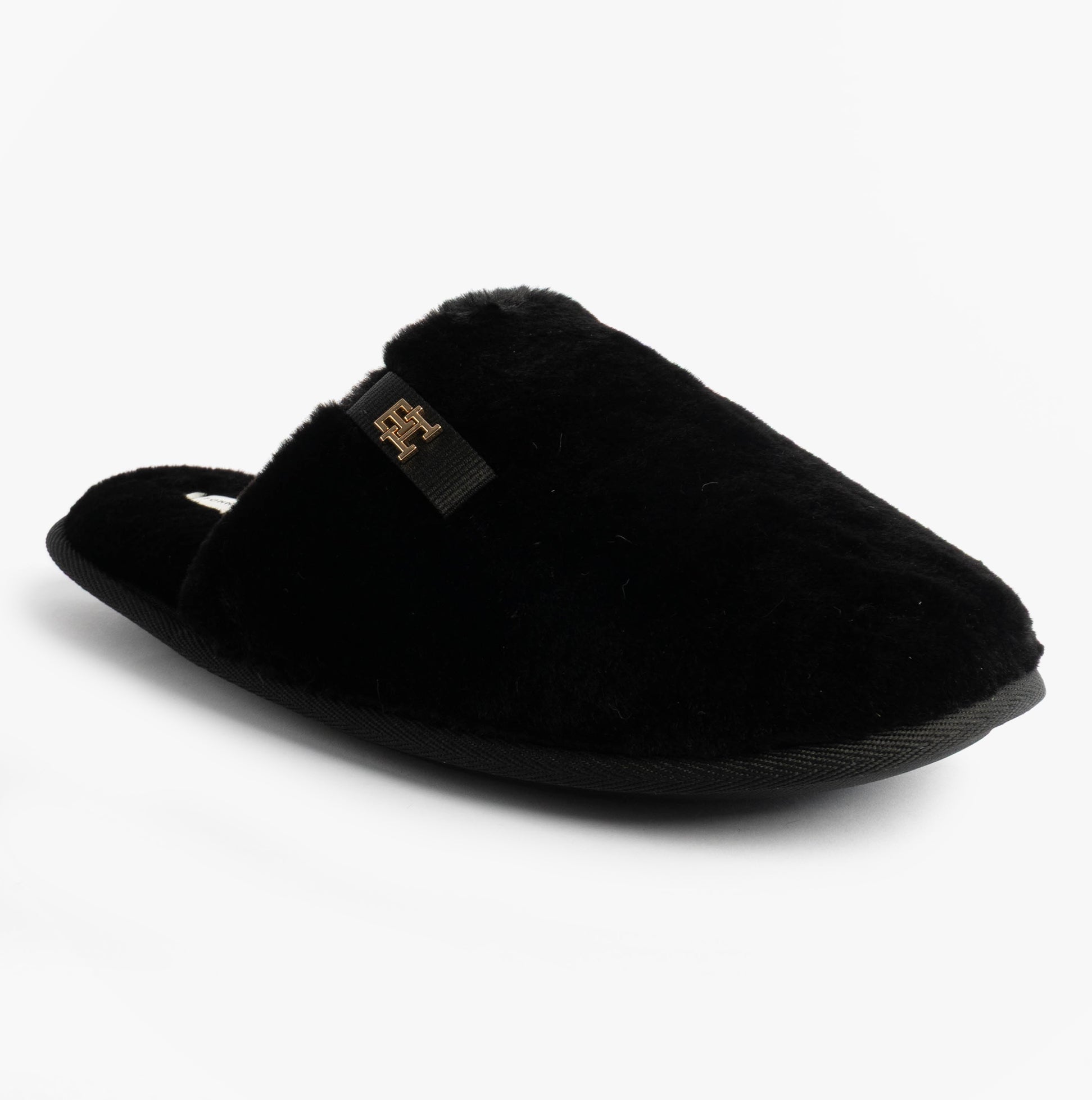 Tommy Hilfiger TH FAUX FUR HOUSE SH Womens Slippers Black side view, featuring soft faux fur material and slip-on design.