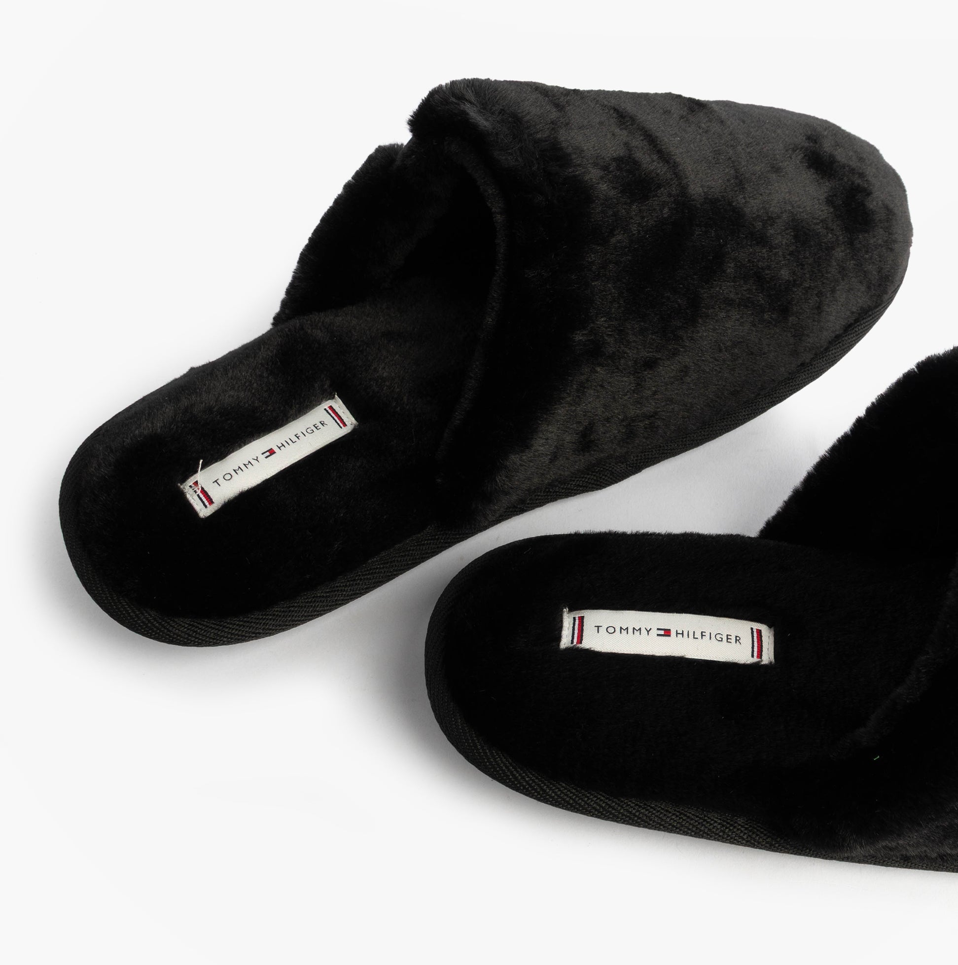 Tommy Hilfiger TH FAUX FUR HOUSE SH Womens Slippers Black top view with plush texture and logo detail.