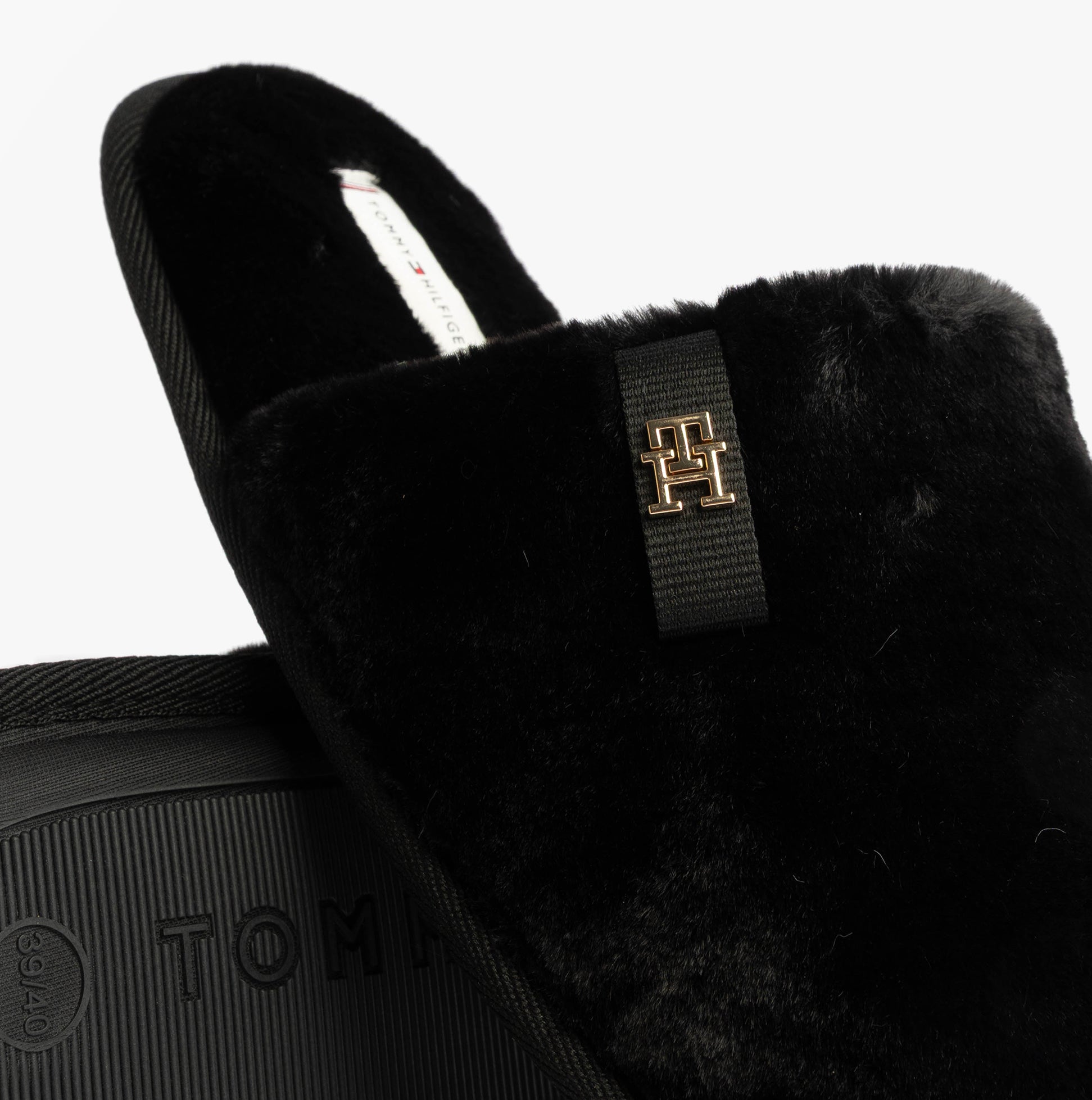 Tommy Hilfiger TH FAUX FUR HOUSE SH Womens Slippers Black detail view showcasing the plush upper and logo.