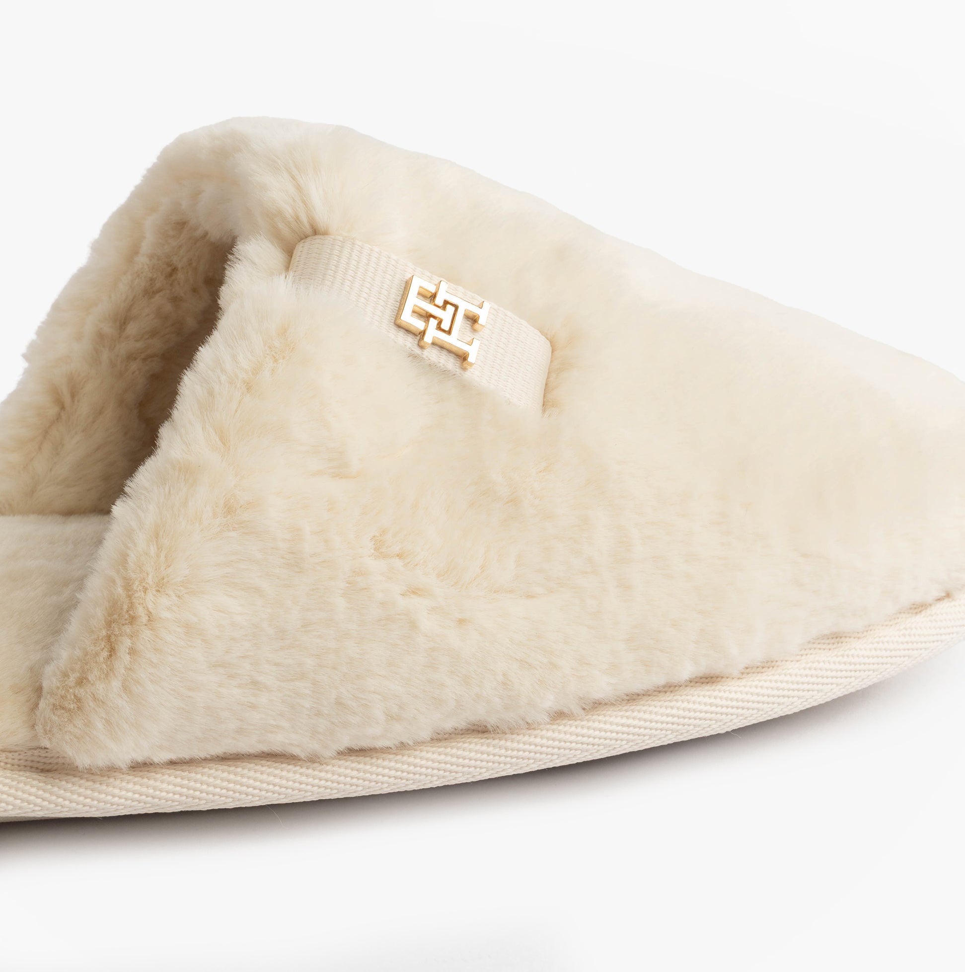 Tommy Hilfiger TH FAUX FUR HOUSE SH Womens Slippers Ancient White side view showcasing soft faux fur texture.