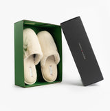 Tommy Hilfiger TH FAUX FUR HOUSE SH Womens Slippers Ancient White in green box, displaying the slip-on mules from the front.