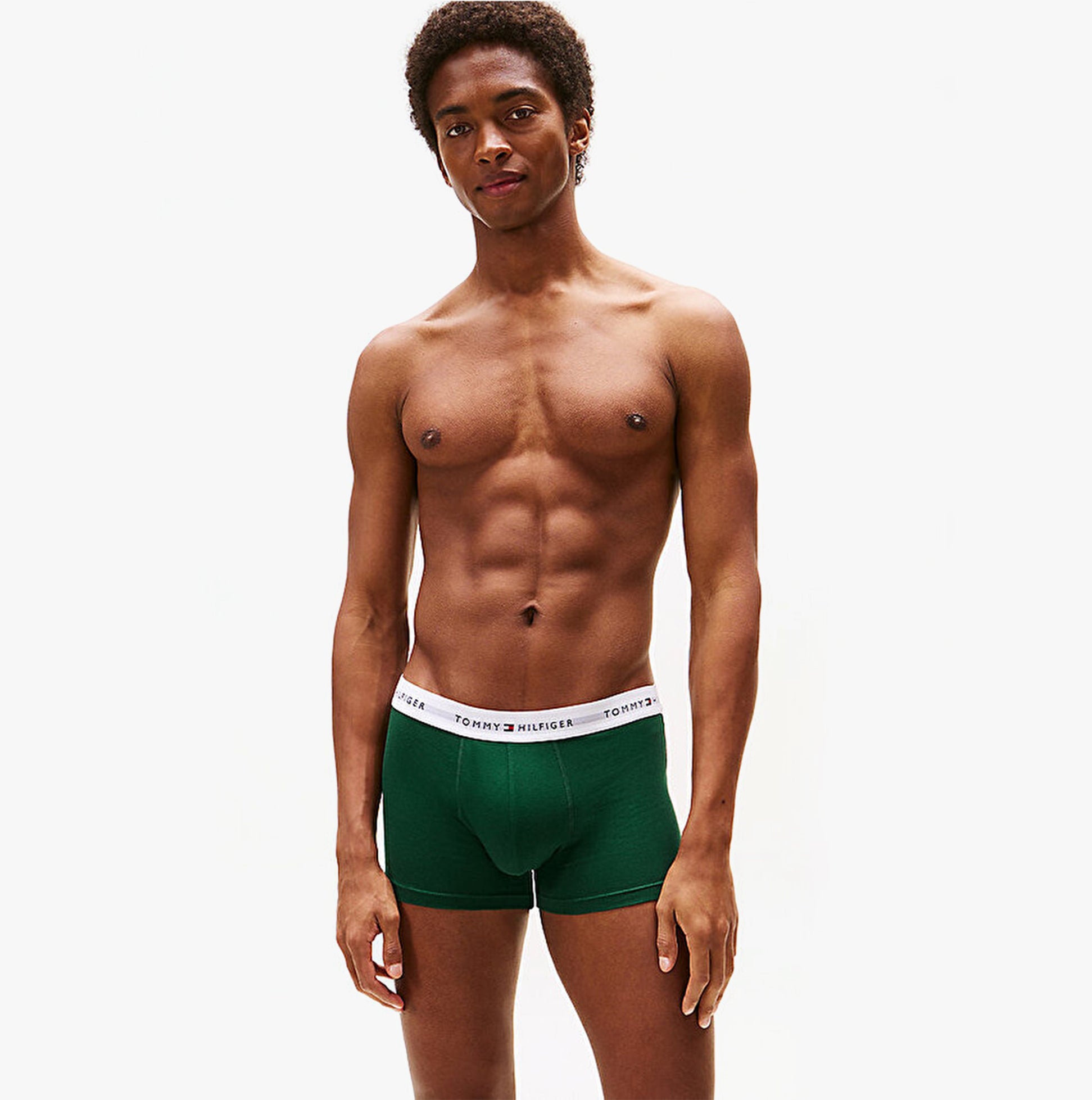 Tommy Hilfiger Mens 3 Pack Logo Waistband Trunks Multi shown in green front view with model wearing.