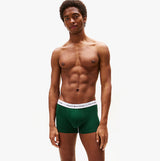 Tommy Hilfiger Mens 3 Pack Logo Waistband Trunks Multi shown in green front view with model wearing.