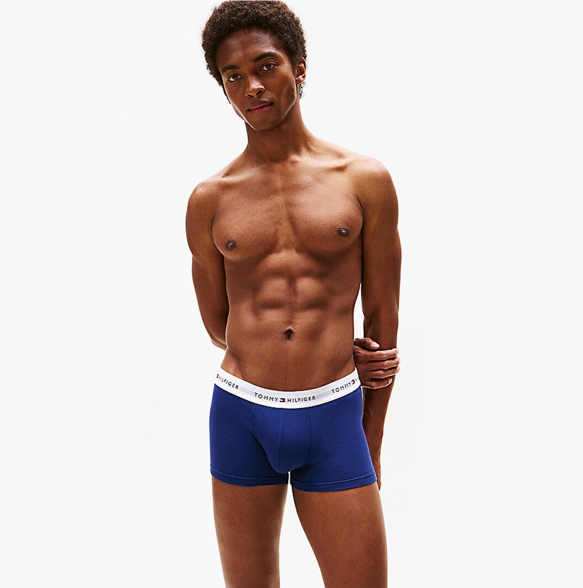 Tommy Hilfiger Mens 3 Pack Logo Waistband Trunks Multi, side view of a model in blue trunks with logo waistband.