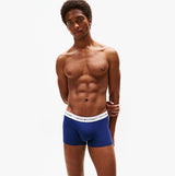 Tommy Hilfiger Mens 3 Pack Logo Waistband Trunks Multi, side view of a model in blue trunks with logo waistband.