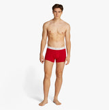 Tommy Hilfiger 3 Pack Mens Logo Waistband Trunks Multicoloured front view showing a model wearing red trunks with logo waistband.