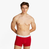 Tommy Hilfiger 3 Pack Mens Logo Waistband Trunks Multicoloured front view model wearing red trunks with TH logo waistband.