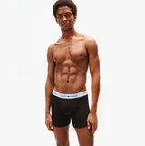 Tommy Hilfiger BOXER BRIEF 3 Pack Mens Cotton Stretch Black front view on model showcasing fit and style.