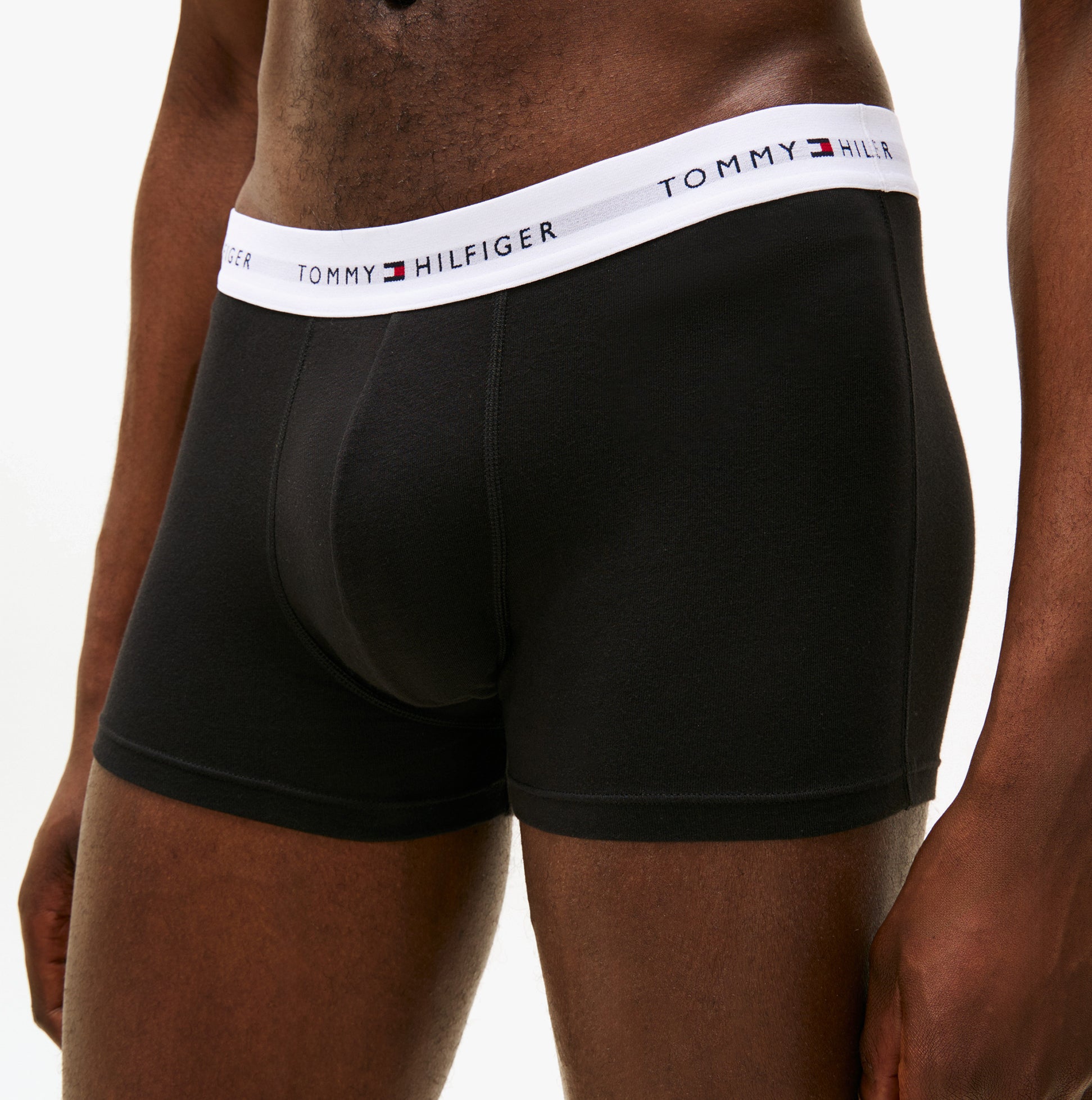 Tommy Hilfiger Mens 3 Pack Trunks Black side view showcasing black trunks with branded waistband.