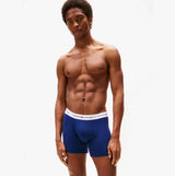Tommy Hilfiger Mens 3 Pack Logo Waistband Boxer Briefs Multi, front view on model wearing navy blue. Stylish and comfortable fit.