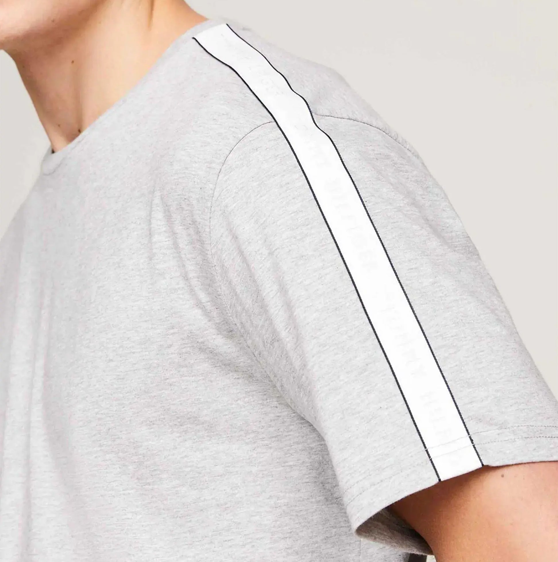 Tommy Hilfiger TEE LOGO Mens Light Grey Ht side view showing sleeve detail with logo tape accents.