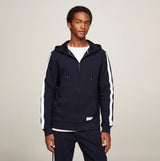 Tommy Hilfiger HWK FZ HOODIE Mens Hoodie Desert Sky front view on model, showcasing navy color and white stripes.