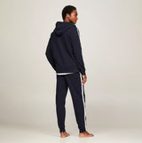 Tommy Hilfiger HWK FZ HOODIE Mens Hoodie Desert Sky back view on model wearing navy outfit with white stripes.