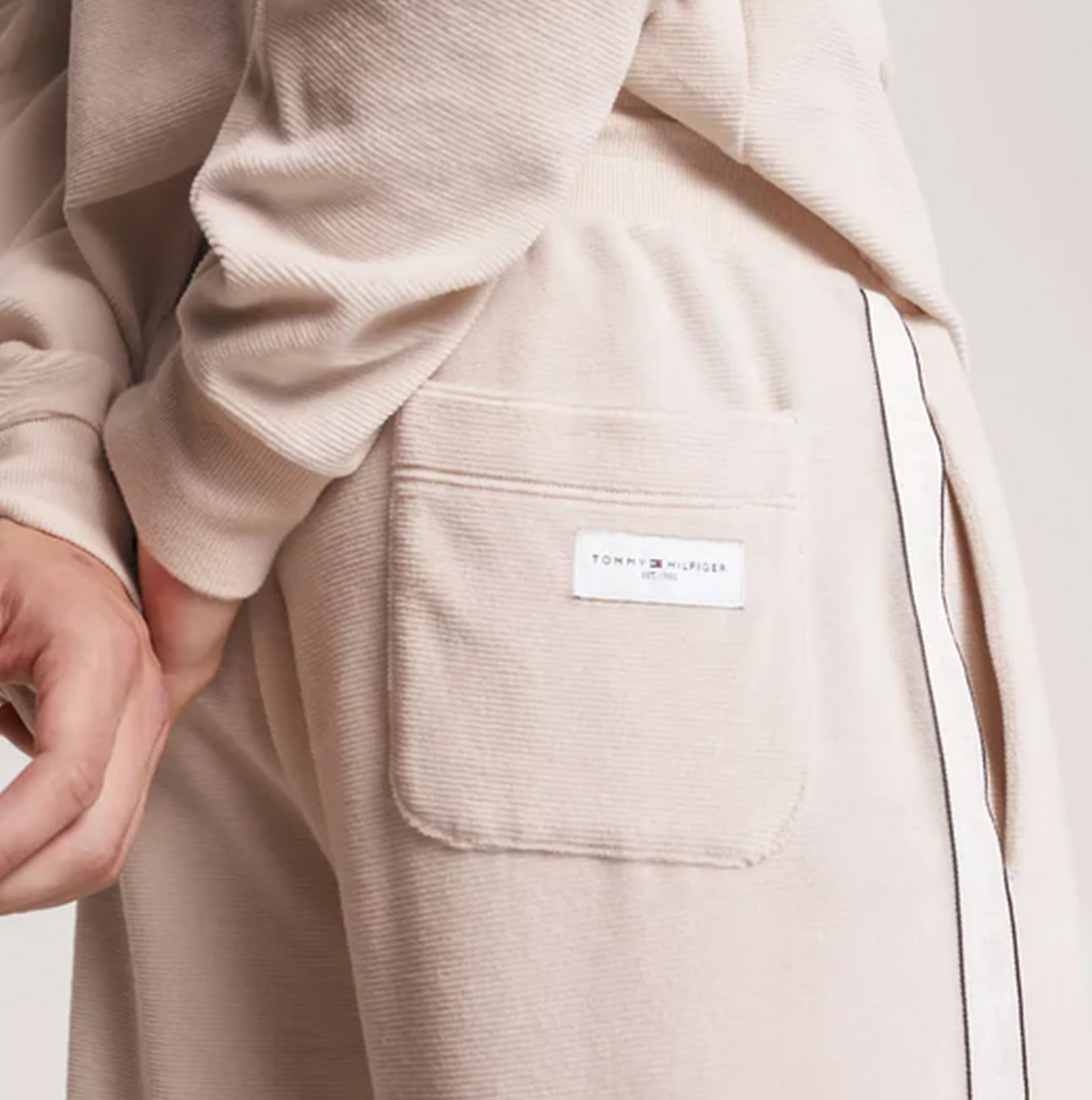 Tommy Hilfiger TH ESTABLISHED Mens Ribbed Velour Lounge Joggers Cashmere Creme side view highlighting pocket detail.