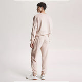 Tommy Hilfiger TH ESTABLISHED Mens Ribbed Velour Lounge Joggers Cashmere Creme back view with elasticated waist and ribbed texture.