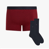 Tommy Hilfiger TRUNK PRINT & SOCK SET GOLD Mens Multicoloured side view showing red patterned trunks and navy socks.