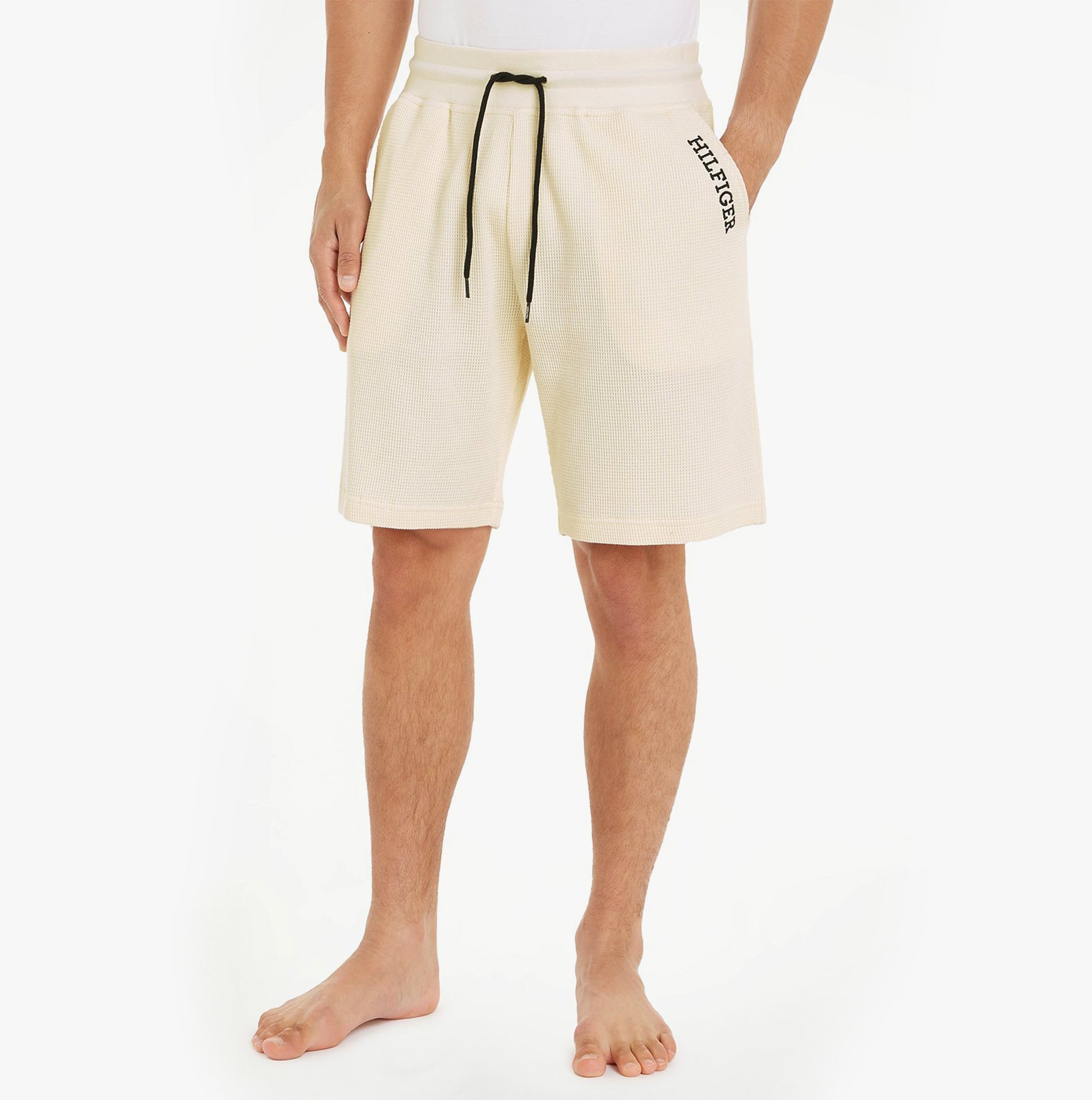 Tommy Hilfiger SHORTS Mens Calico front view, lightweight cream cotton shorts with drawstring waist and logo.