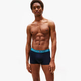 Tommy Hilfiger Mens 3 Pack Logo Waistband Trunks Navy front view model wearing trunks with logo waistband