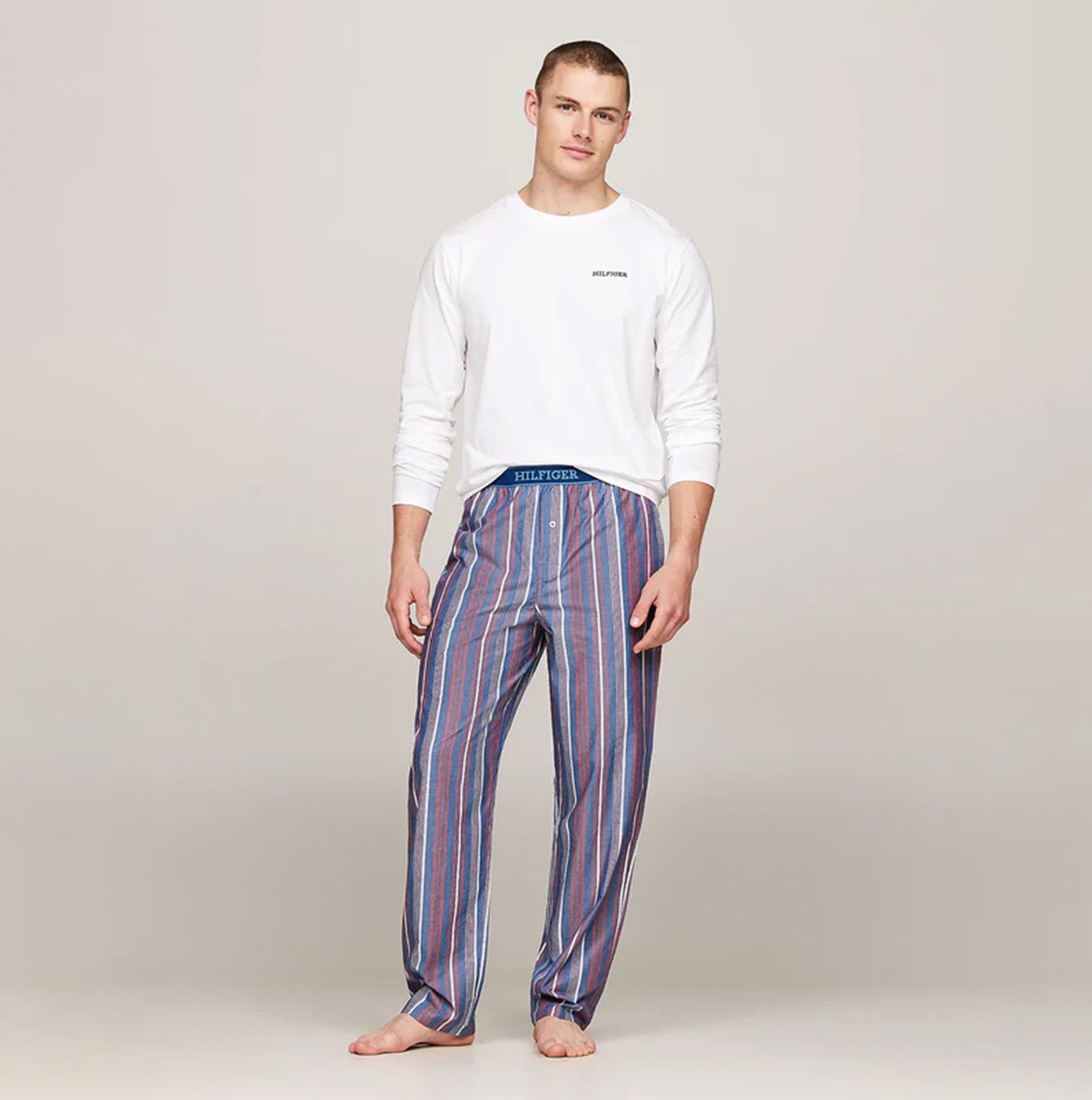 Tommy Hilfiger MONOTYPE Mens Pyjama Set White/Monotype Stripes Indigo front view 100% cotton long sleeve and elasticated waistband trousers.