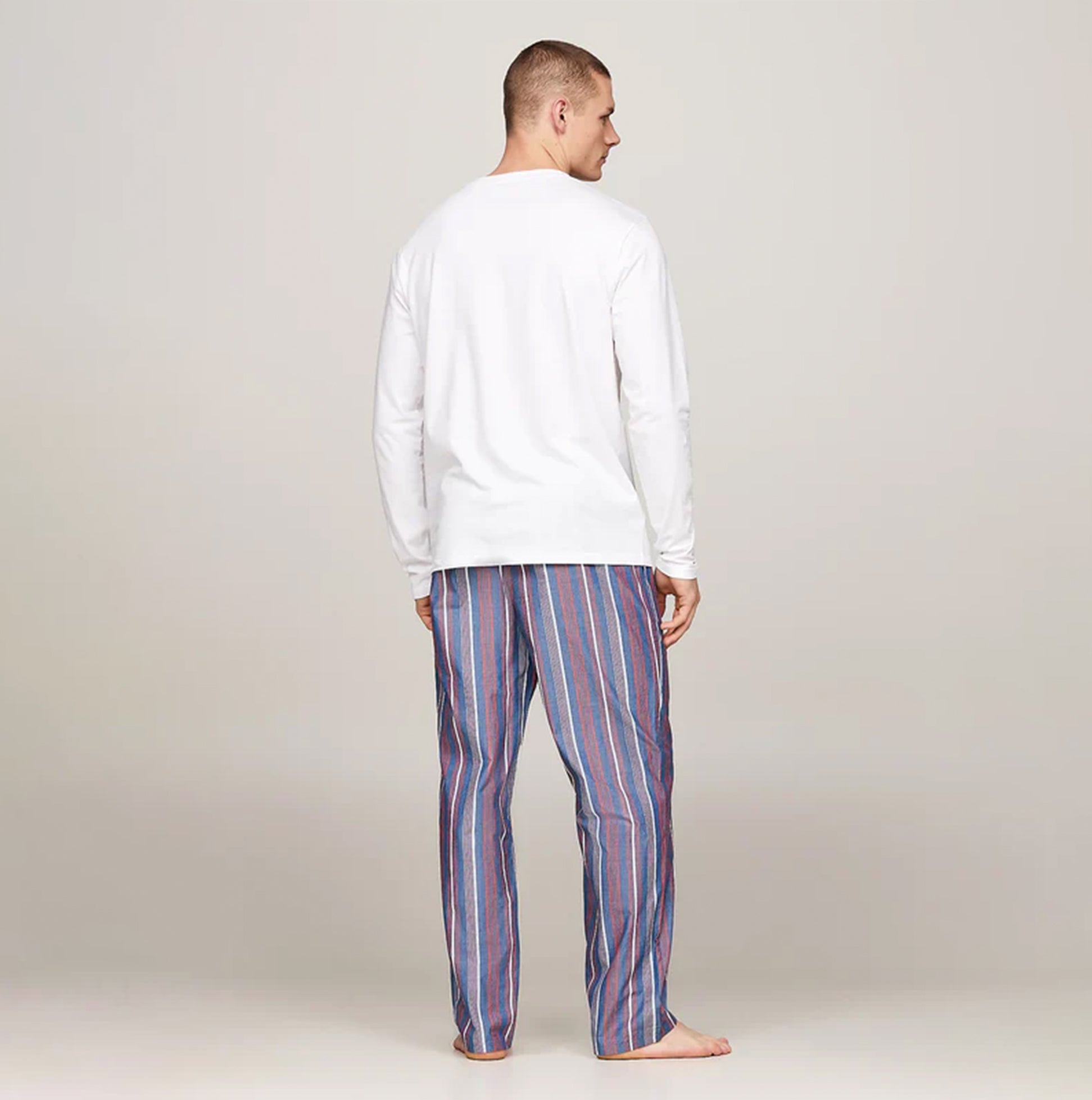 Tommy Hilfiger MONOTYPE Mens Pyjama Set White/Monotype Stripes Indigo back view showcasing long sleeve top and striped pants.