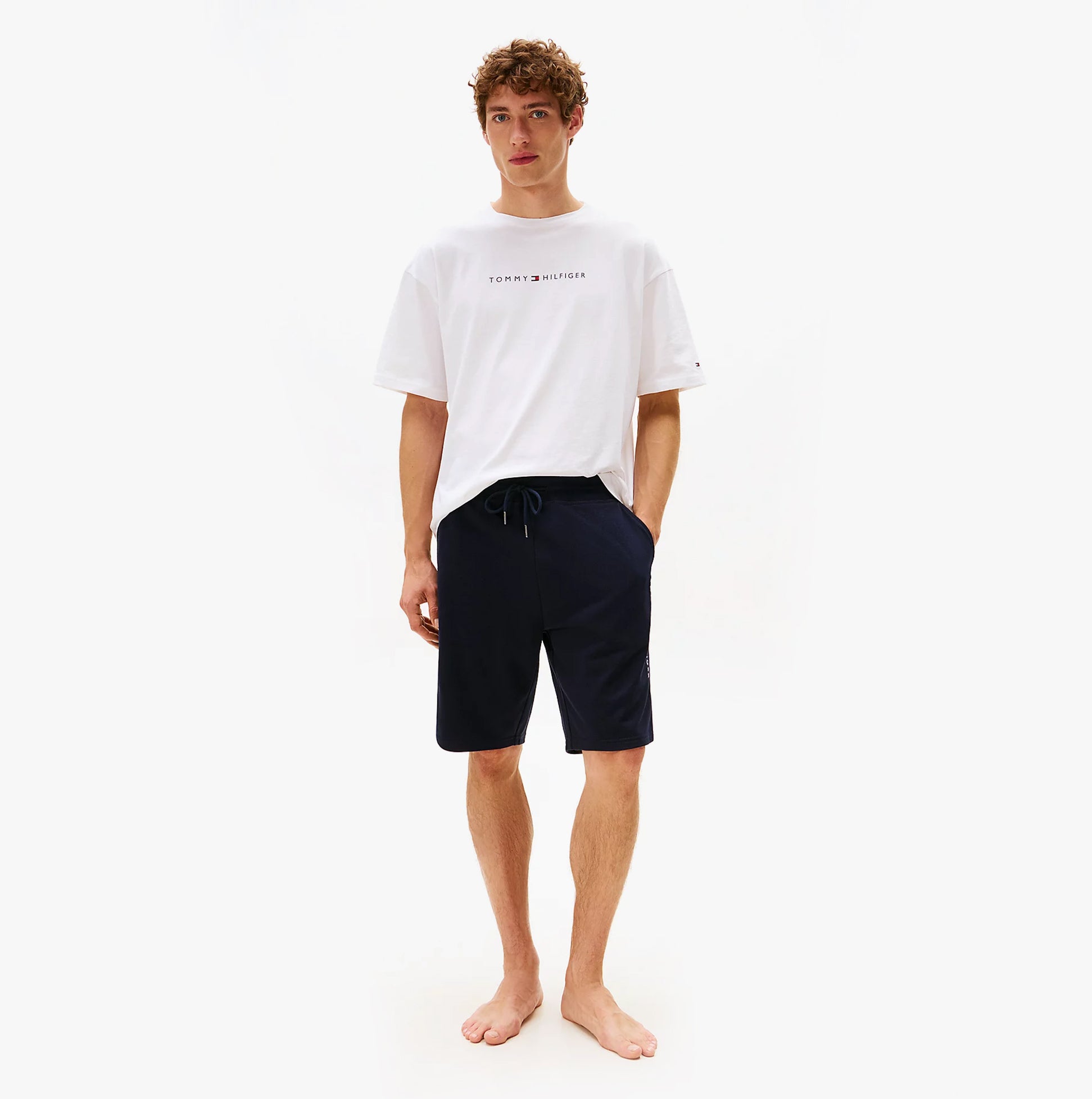 Tommy Hilfiger Mens TH Original Logo Terry Lounge Shorts Navy front view worn by model with white t-shirt.