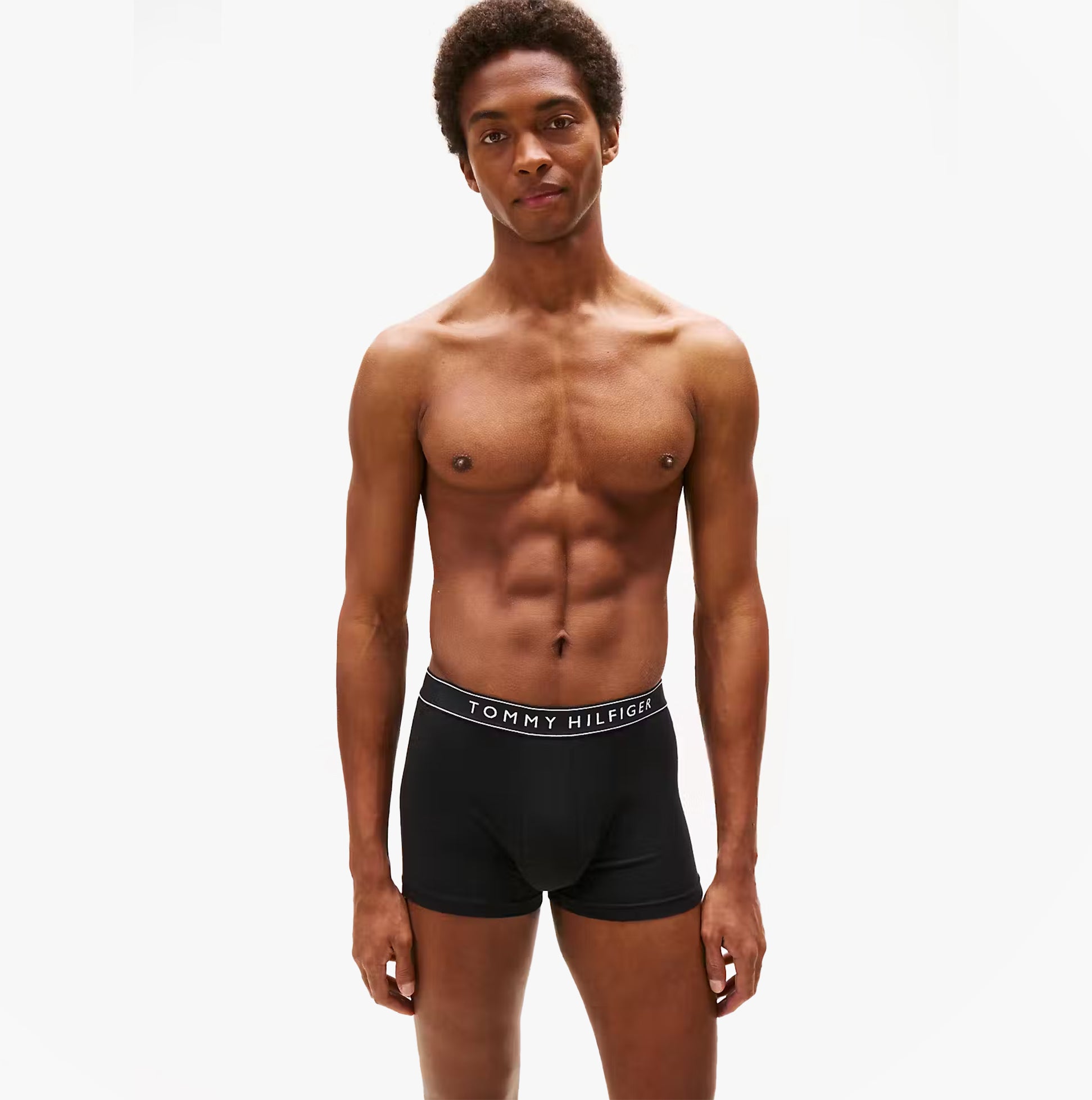 Tommy Hilfiger Mens 3 Pack Trunks Grey/Black/White front view of model wearing black trunks