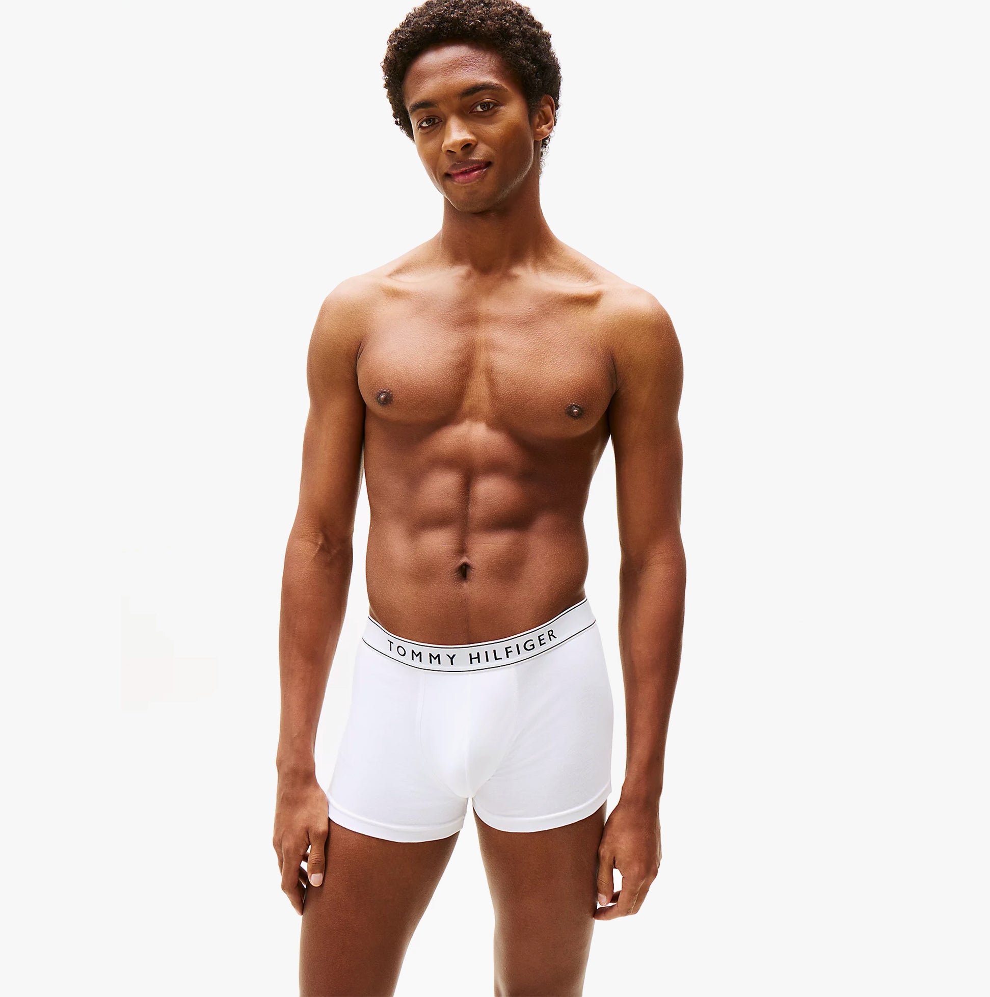 Tommy Hilfiger Mens 3 Pack Logo Waistband Trunks Multi front view model wearing white trunks with logo waistband